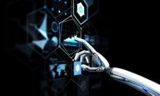 robot hand touching virtual screen over black